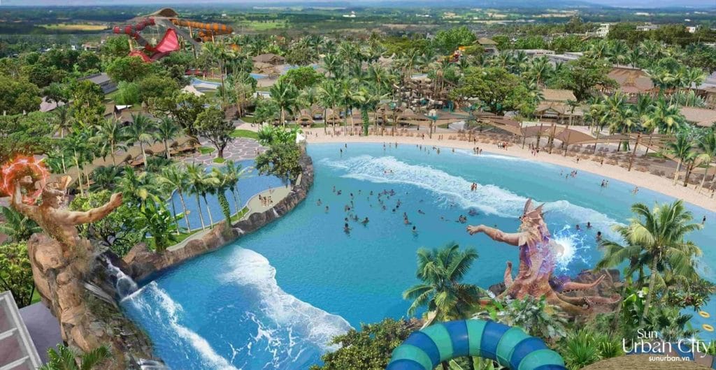 Chung cư Sun Bắc Ninh - Cơ hội đầu tư vàng tại trung tâm thành phố 5 Hình ảnh toàn cảnh khu vui chơi nước tại Sun Bắc Ninh, với hồ bơi sóng lớn, tượng thần biển khổng lồ, cây cọ xanh mát, và các đường trượt nước đầy màu sắc, tạo nên không gian giải trí độc đáo.